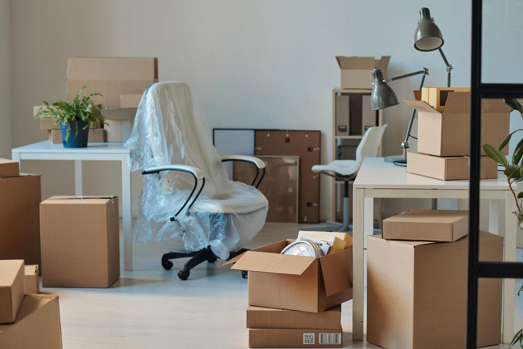 Horizontal image of big office with furniture and cardboard boxes